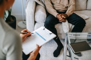 therapy session man and woman clipboard cbt in wakefield